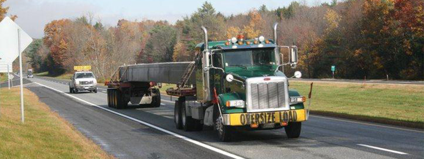 Flatbed Truck hauling an oversized load