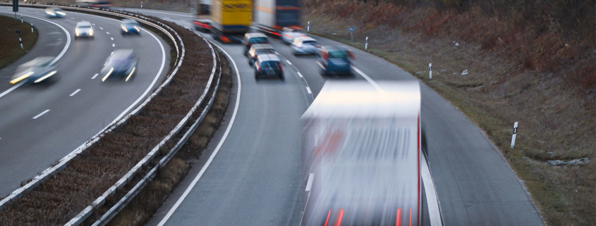 Trucks and Vehicles on the highway driving fast